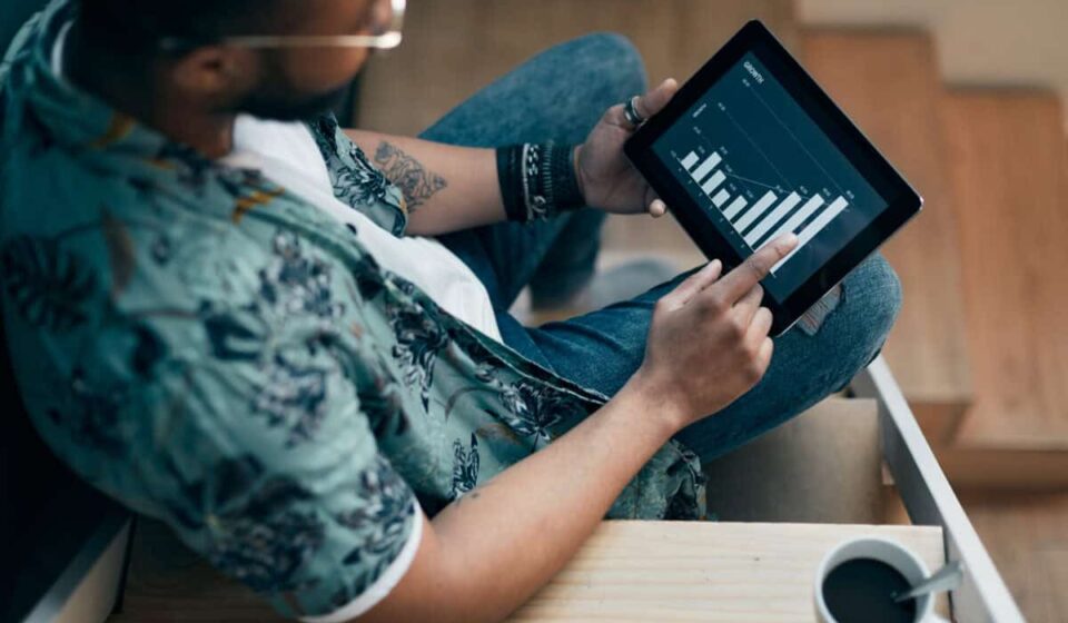 An investor uses a tablet