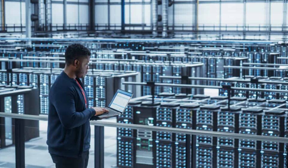 Data Center Engineer Using Laptop Computer crypto mining