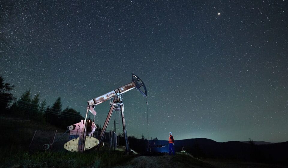 oil pump jack under night sky
