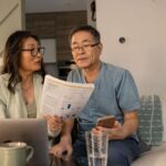 senior couple looks at investing statements