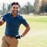 The Best Canadian Dividend Stocks if You Want Passive Income Happy golf player walks the course